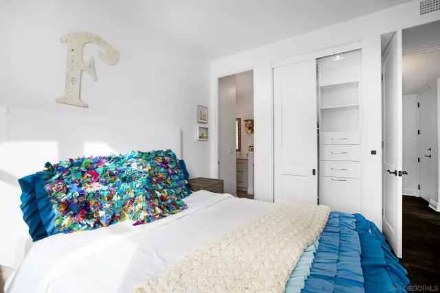 a view of a living room hardwood floor and a flat screen tv