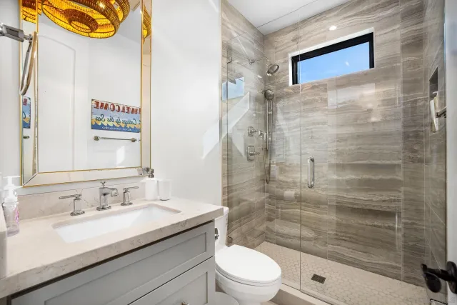 a view of a bathroom with a sink and mirror