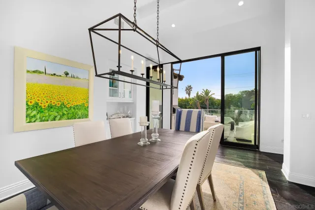 a bathroom with a granite countertop sink and mirror