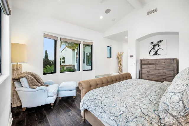 a view of a patio with table and chairs with wooden floor and fence