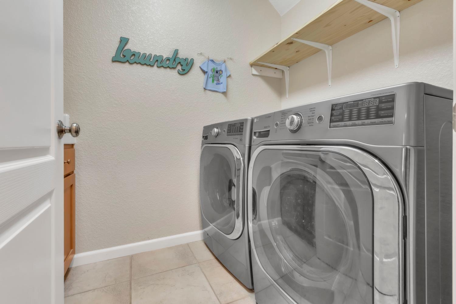 2993 Essie Place Modesto, CA 95355 - Photo 15 of 44 a utility room with dryer and washer