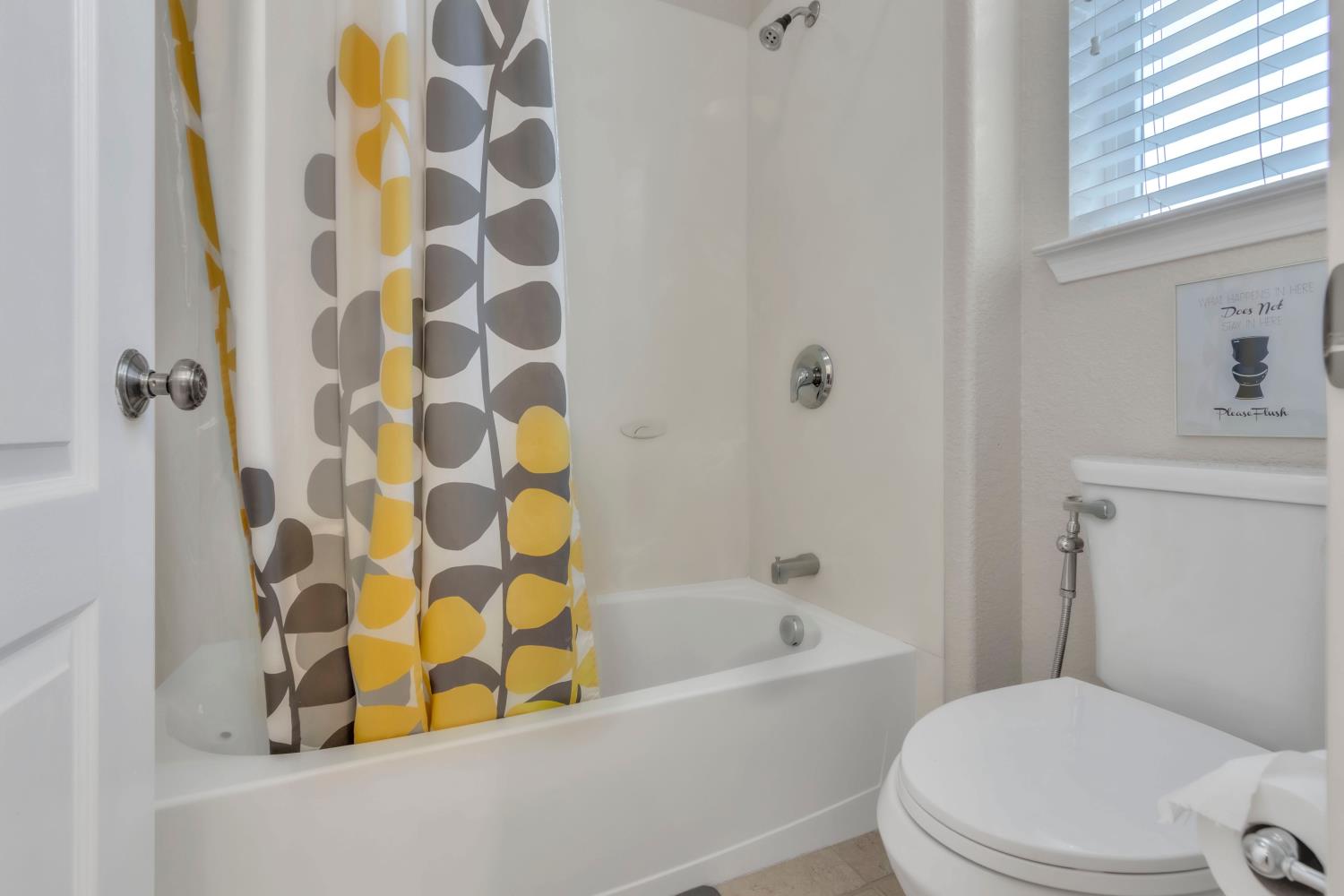 2993 Essie Place Modesto, CA 95355 - Photo 26 of 44 a white bath tub sitting next to a white toilet