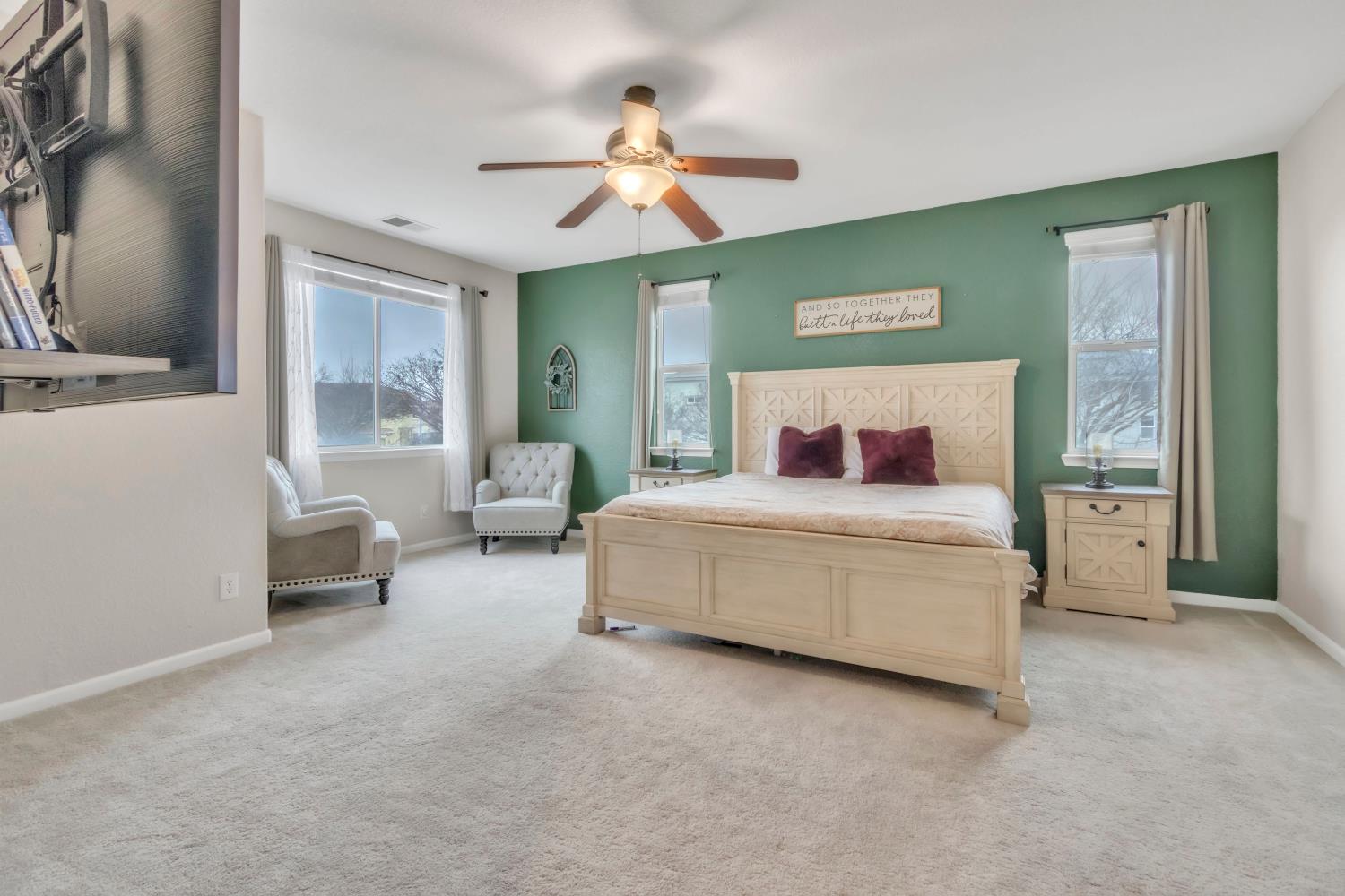 2993 Essie Place Modesto, CA 95355 - Photo 30 of 44 a bedroom with a bed and a chandelier