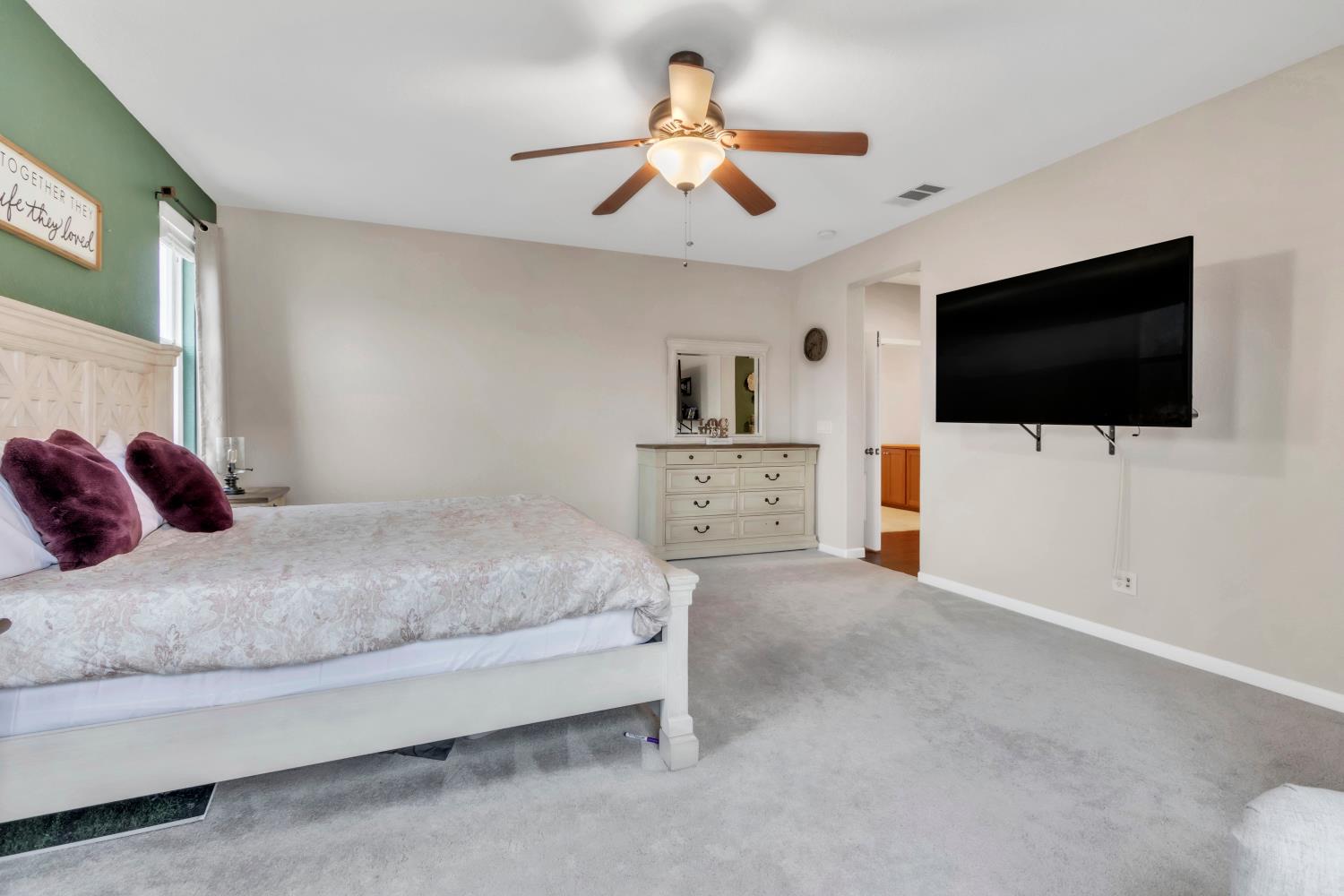 2993 Essie Place Modesto, CA 95355 - Photo 32 of 44 a bedroom with a bed and a flat screen tv