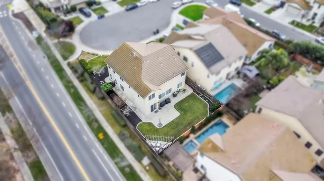 an aerial view of a house with outdoor space