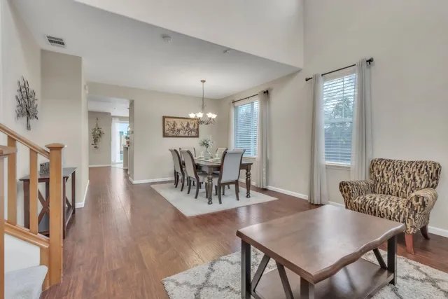 a view of a dining room with furniture window and wooden floor