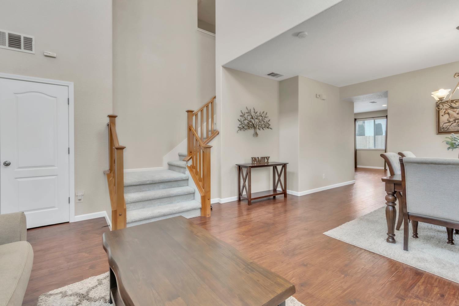 2993 Essie Place Modesto, CA 95355 - Photo 5 of 44 a view of a livingroom with furniture and staircase