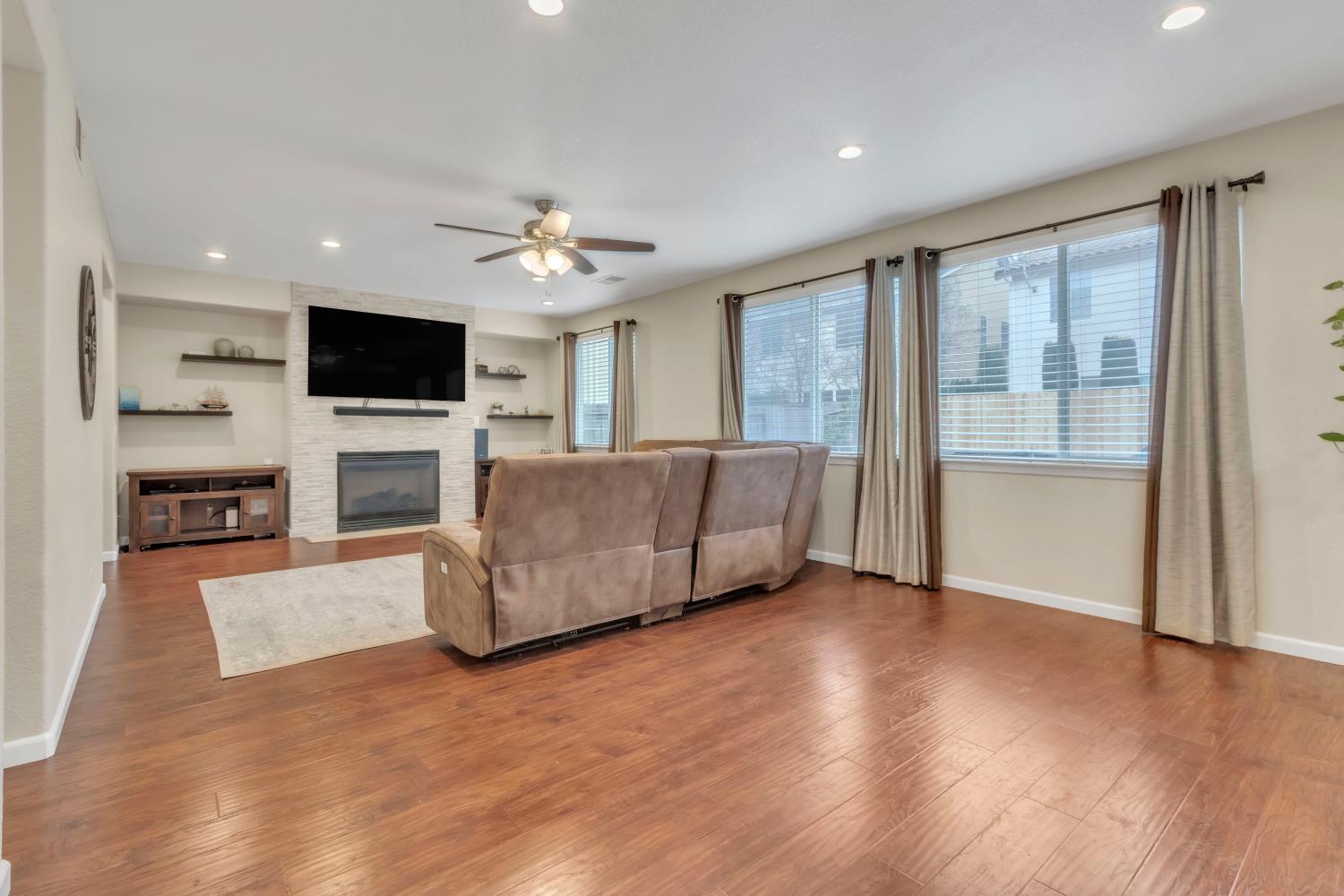 2993 Essie Place Modesto, CA 95355 - Photo 8 of 44 a living room with furniture and a flat screen tv