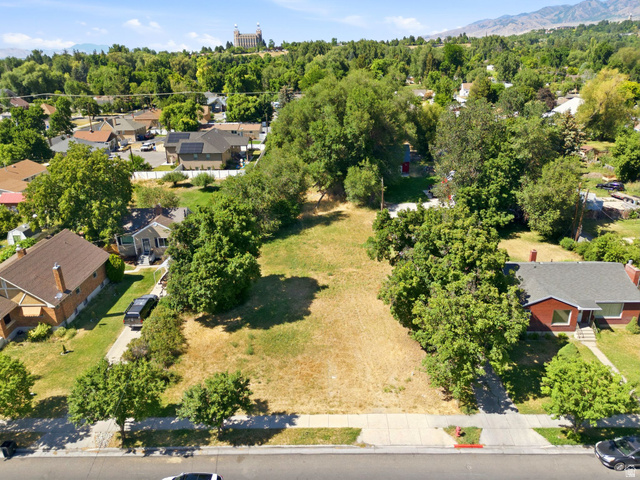 300 East S, Unit 2 Logan, UT 84321 - Photo 1 of 38 Expansive residential lot featuring mature trees and a paved street frontage