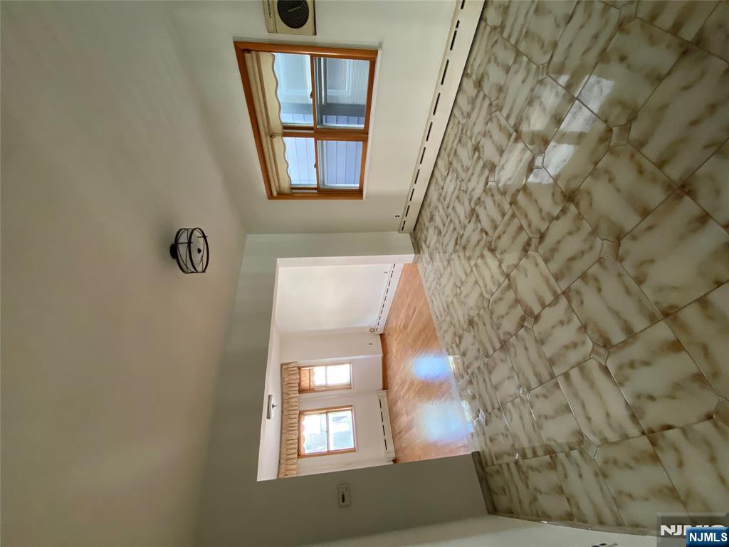 133 Oak Street, Unit 1 Weehawken, NJ 07086 - Photo 5 of 9 a view of empty room with window