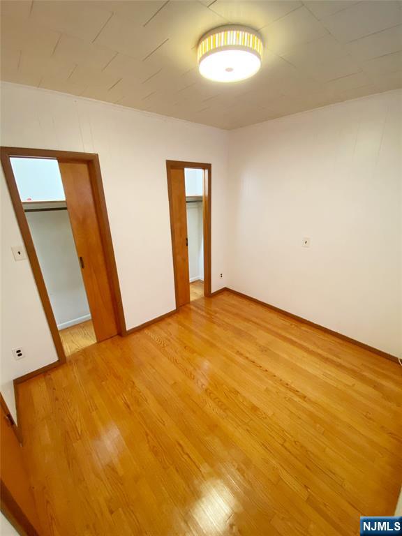 133 Oak Street, Unit 1 Weehawken, NJ 07086 - Photo 7 of 9 a view of empty room with wooden floor