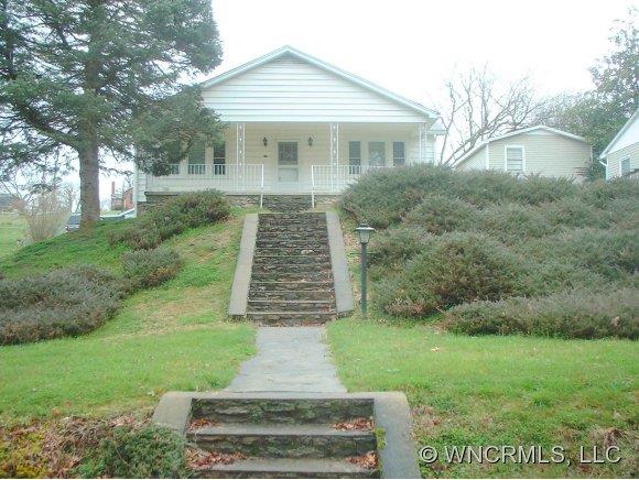 118 Caring Pl Loop Clyde, NC 28721 - Photo 1 of 3 a front view of house with yard and green space