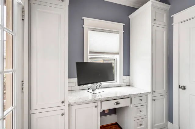 a kitchen with a sink and cabinets