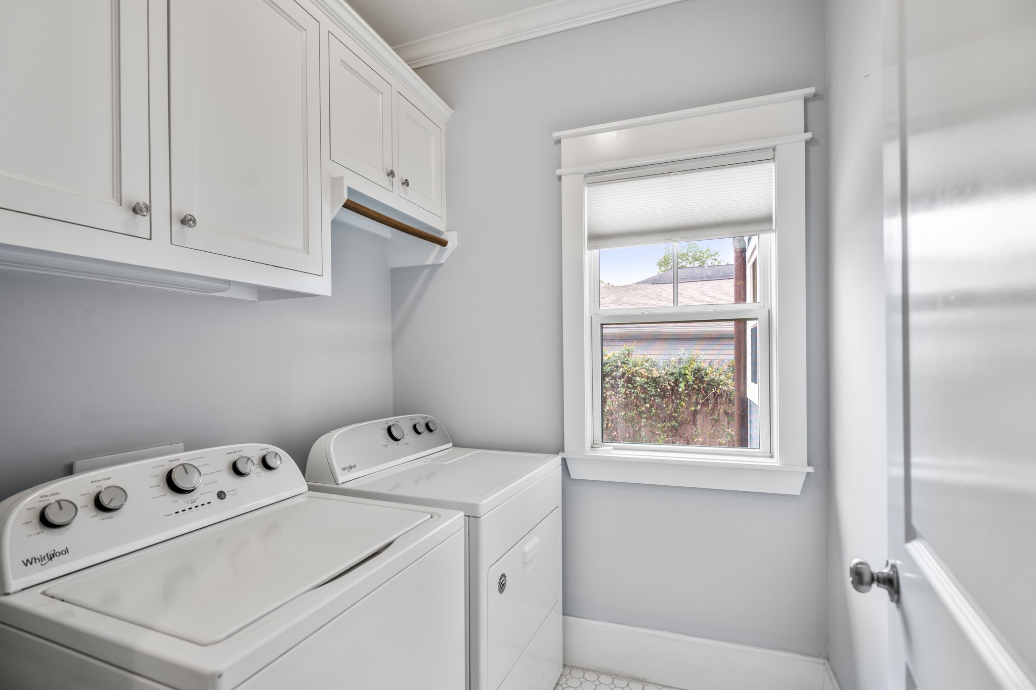 823 East 27th Street Houston, TX 77009 - Photo 28 of 49 a view of washer and dryer with bathroom in the background