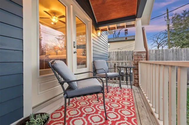 a view of two chairs in the balcony