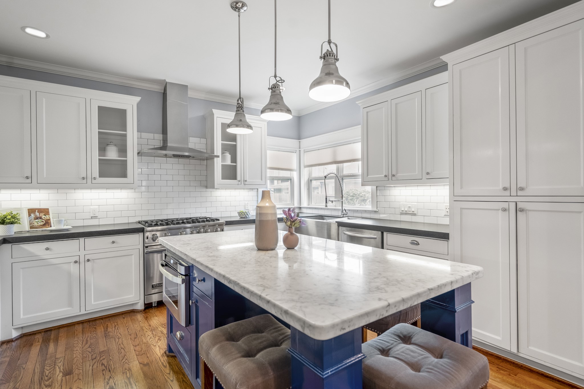 823 East 27th Street Houston, TX 77009 - Photo 4 of 49 a kitchen with stainless steel appliances granite countertop a sink a stove and chairs
