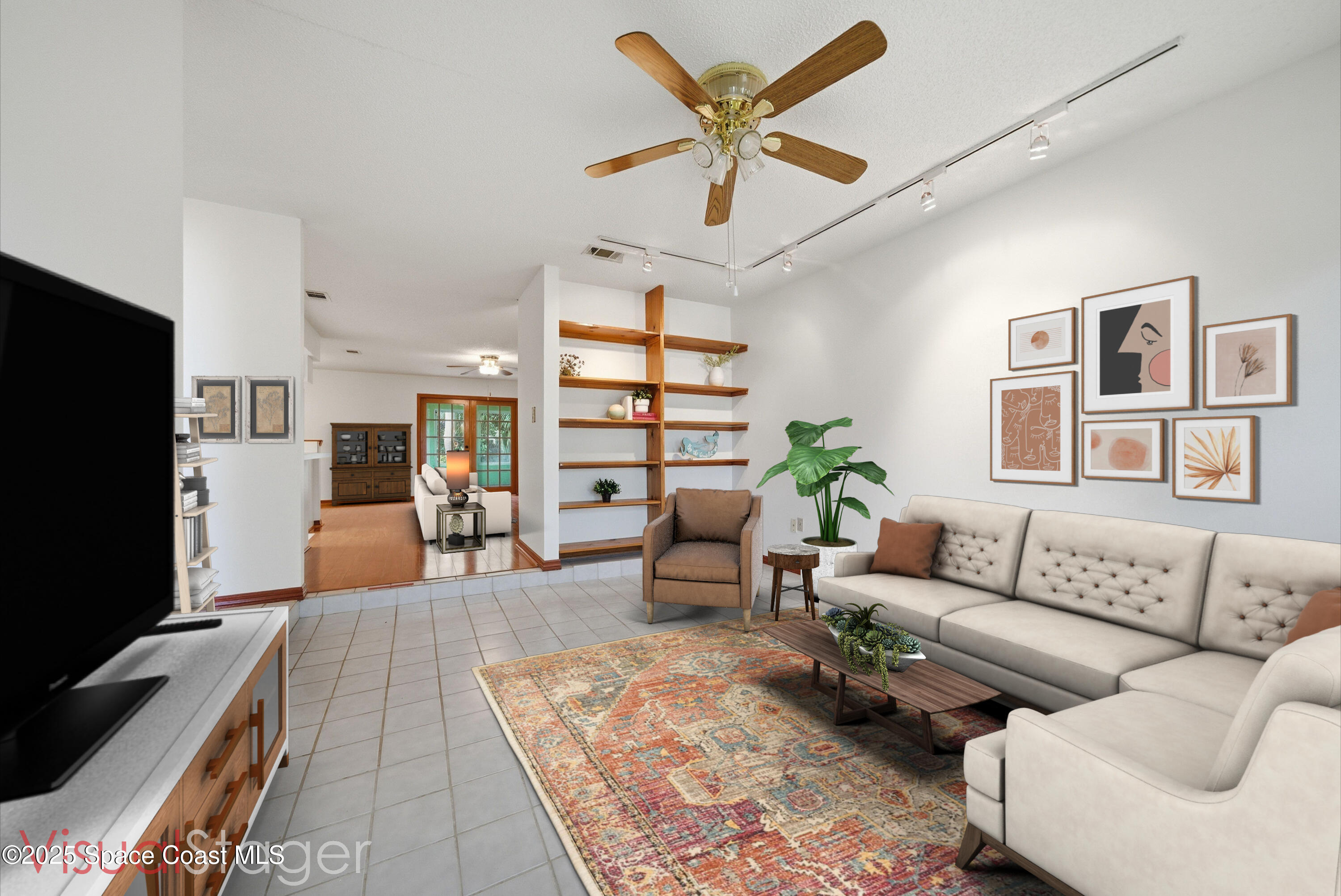 2108 Rosewood Drive Melbourne Beach, FL 32951 - Photo 2 of 39 a living room with furniture and a flat screen tv