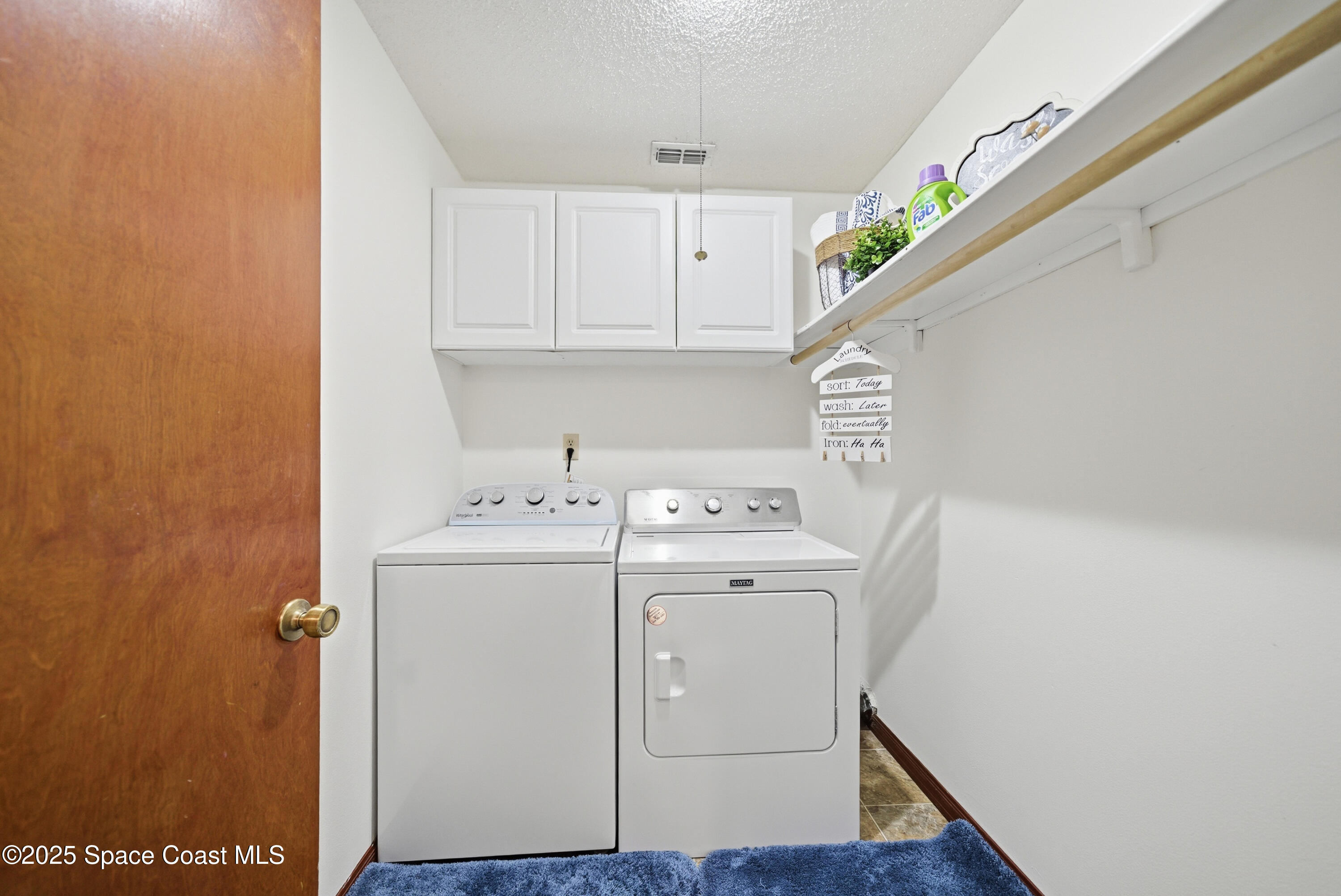 2108 Rosewood Drive Melbourne Beach, FL 32951 - Photo 23 of 39 a utility room with dryer and washer
