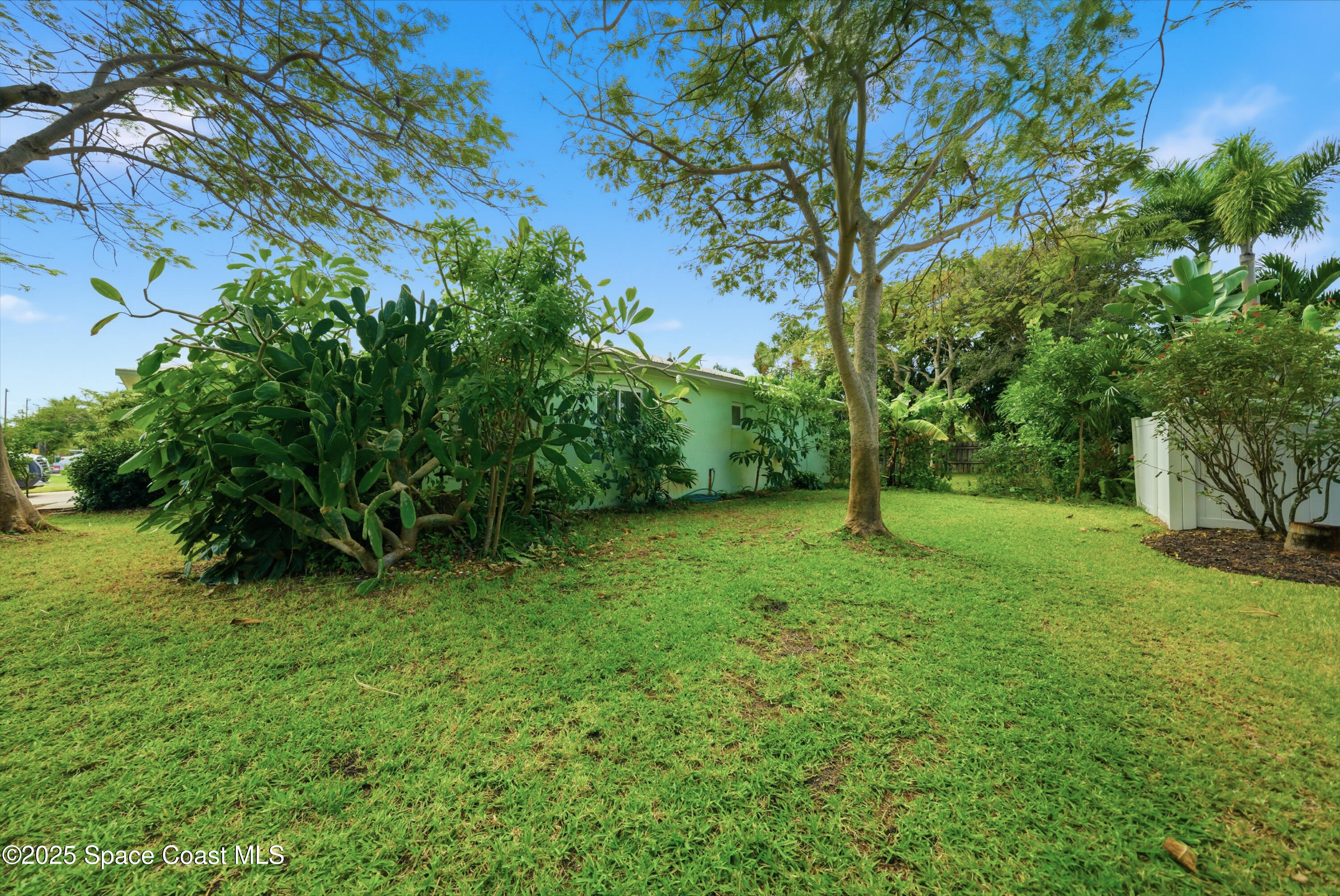 2108 Rosewood Drive Melbourne Beach, FL 32951 - Photo 27 of 39 a view of backyard with green space