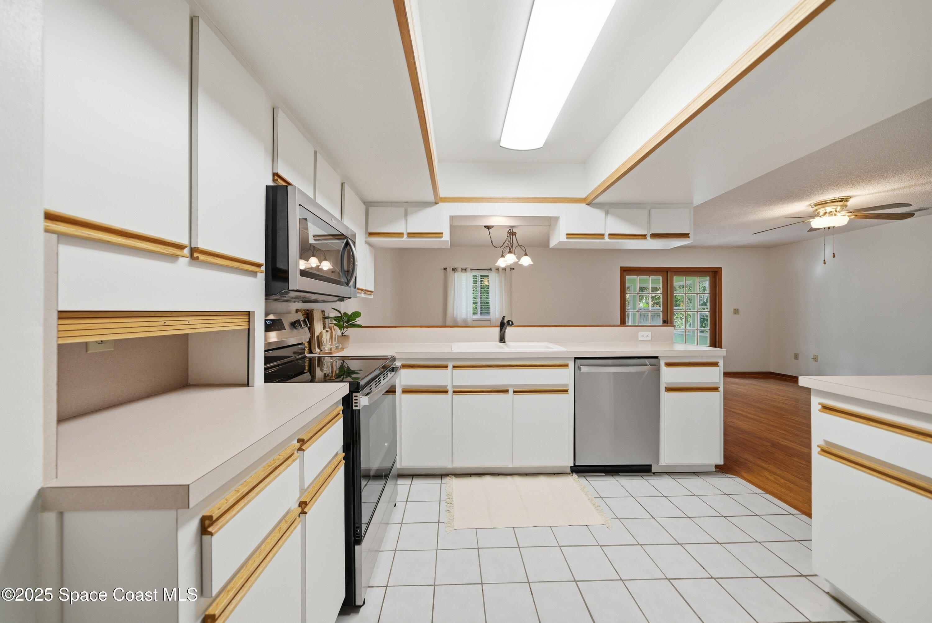 2108 Rosewood Drive Melbourne Beach, FL 32951 - Photo 7 of 39 a kitchen with a sink appliances and cabinets