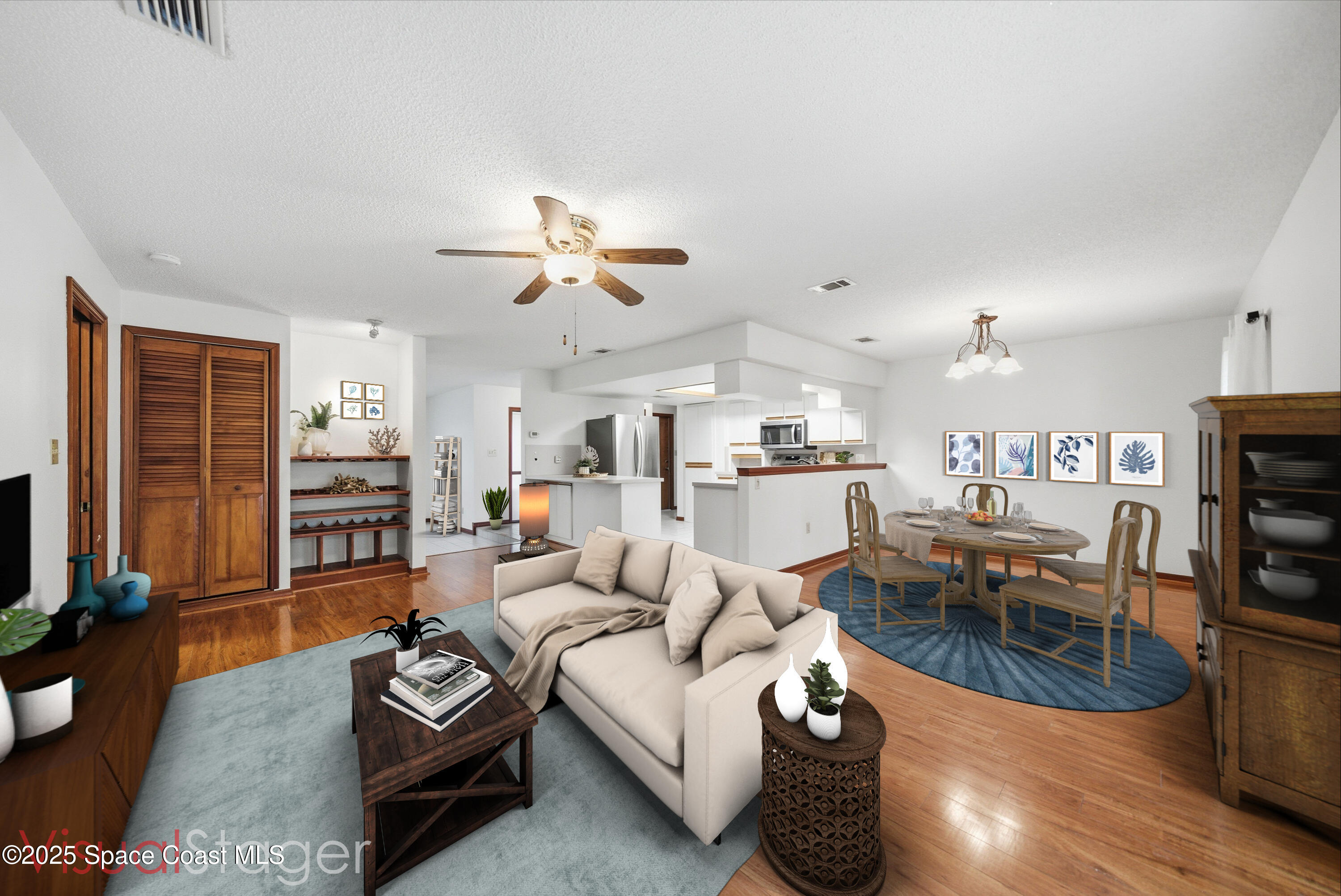 2108 Rosewood Drive Melbourne Beach, FL 32951 - Photo 8 of 39 a living room with furniture kitchen view and a chandelier