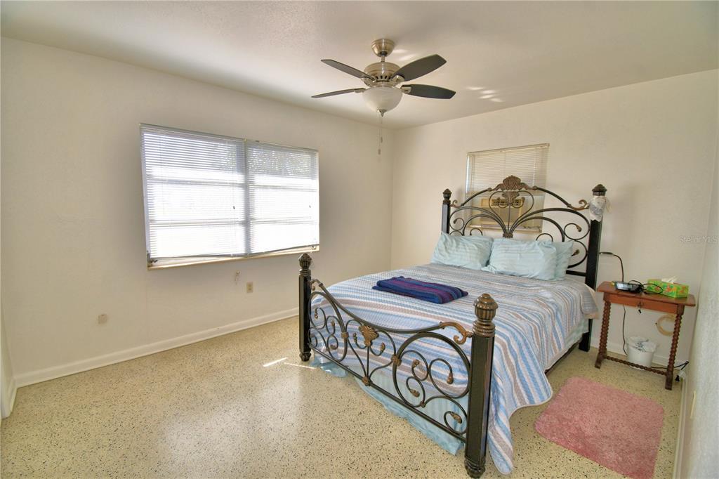 105 Maxcy Lane Frostproof, FL 33843 - Photo 13 of 49 a bedroom with a bed and a window