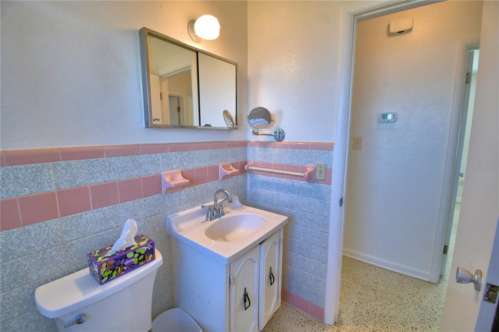 105 Maxcy Lane Frostproof, FL 33843 - Photo 20 of 49 a bathroom with a sink and a mirror