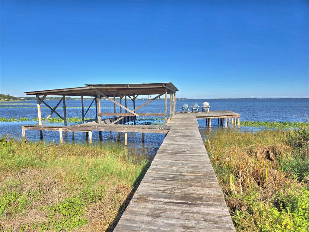 105 Maxcy Lane Frostproof, FL 33843 - Photo 2 of 49 a view of a swimming pool with an outdoor seating