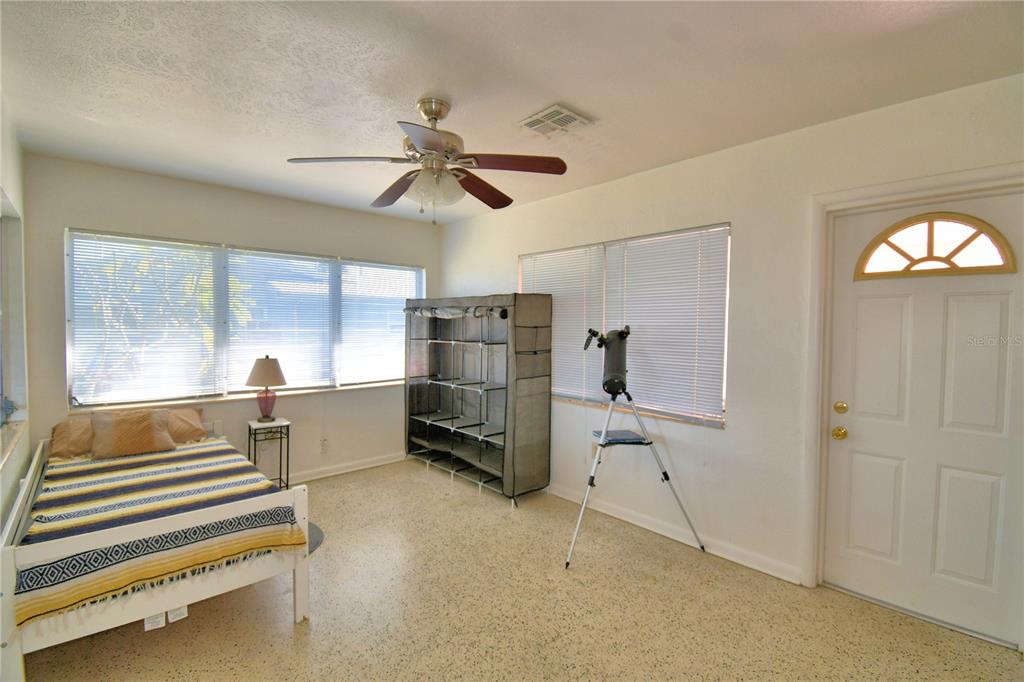 105 Maxcy Lane Frostproof, FL 33843 - Photo 25 of 49 a bedroom with furniture and a window