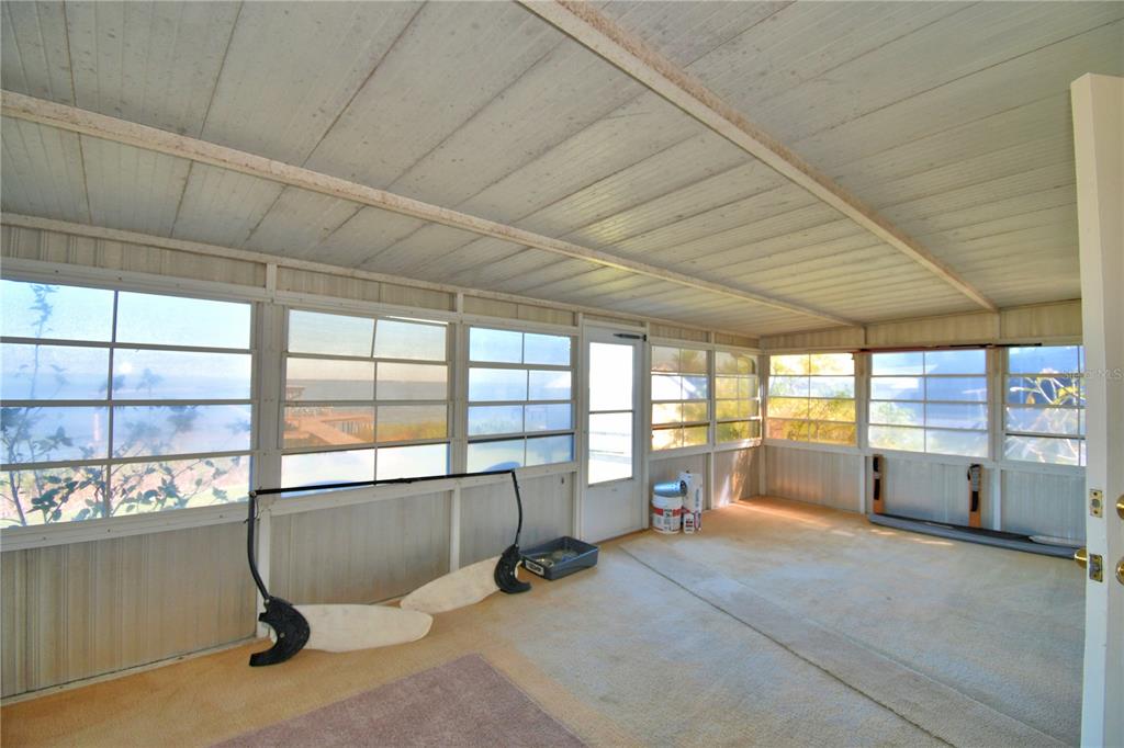 105 Maxcy Lane Frostproof, FL 33843 - Photo 29 of 49 a room with gym equipment and large windows