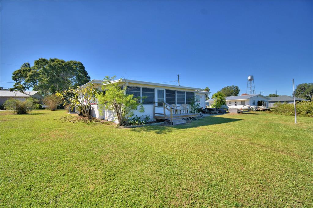 105 Maxcy Lane Frostproof, FL 33843 - Photo 33 of 49 a houses view with swimming pool and furniture