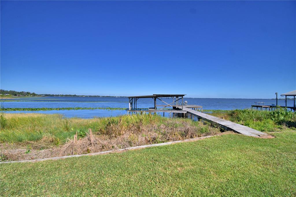 105 Maxcy Lane Frostproof, FL 33843 - Photo 39 of 49 a view of a yard with an ocean pool