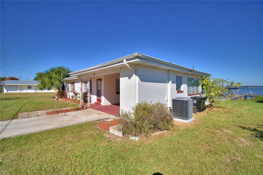 105 Maxcy Lane Frostproof, FL 33843 - Photo 42 of 49 a view of a house with backyard porch and sitting area