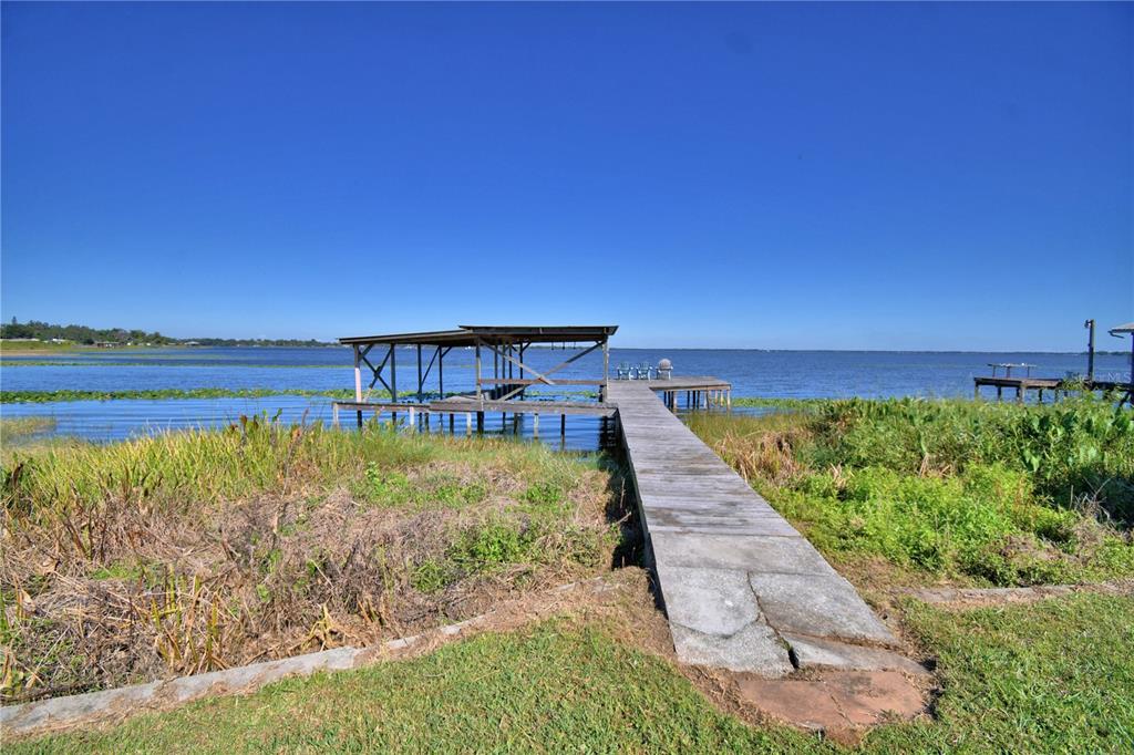 105 Maxcy Lane Frostproof, FL 33843 - Photo 49 of 49 a view of a swimming pool with a yard