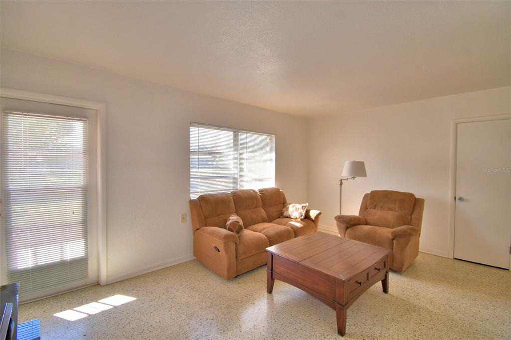 105 Maxcy Lane Frostproof, FL 33843 - Photo 5 of 49 a living room with furniture and a window