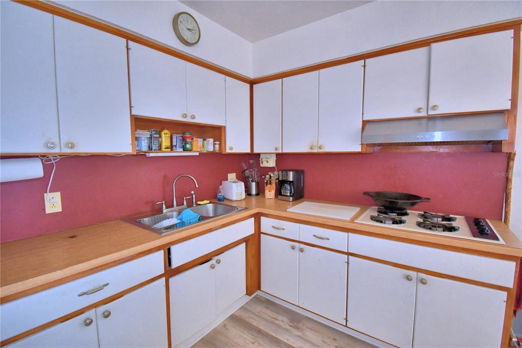 105 Maxcy Lane Frostproof, FL 33843 - Photo 10 of 49 a kitchen with granite countertop cabinets and stainless steel appliances