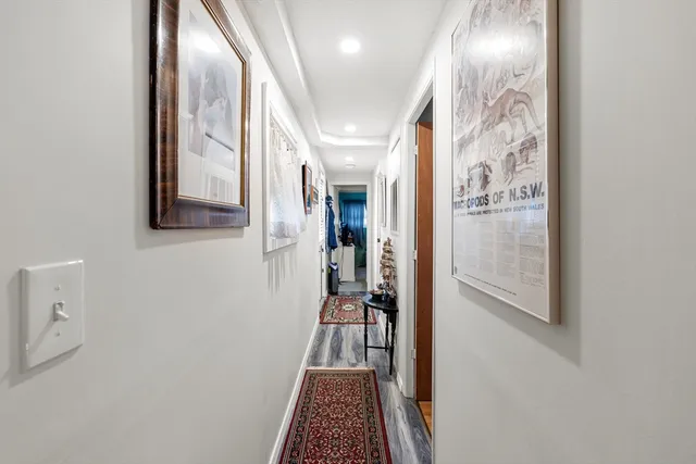 a view of hallway with furniture