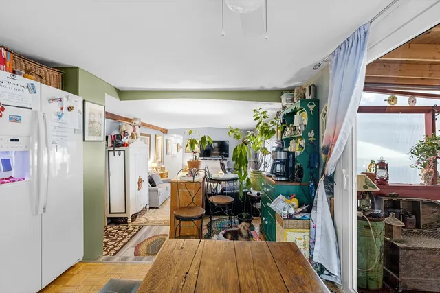 a view of a dining room with furniture window and outside view