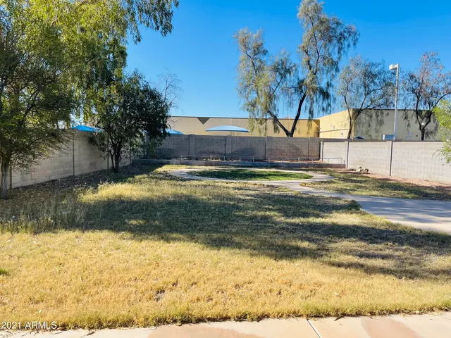 a view of swimming pool with a yard