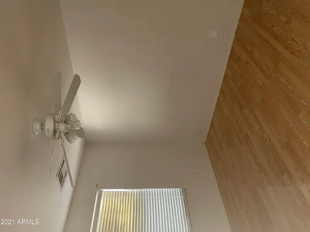 a view of a room with a wooden door