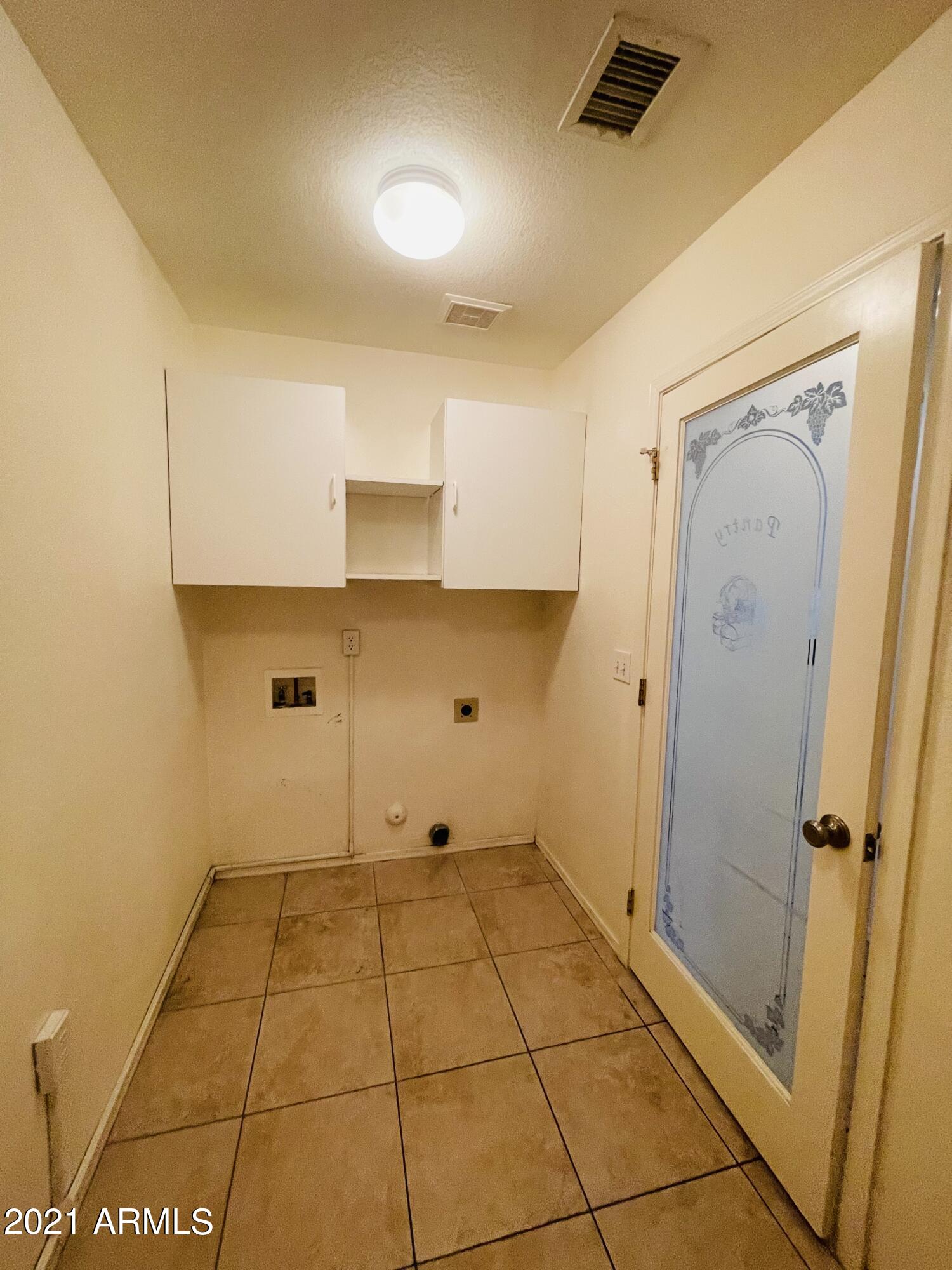 10642 East Arbor Avenue Mesa, AZ 85120 - Photo 10 of 12 a view of a bathroom with a sink and a shower