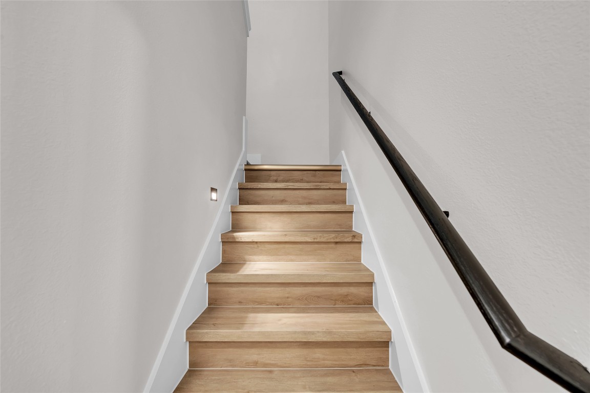 7600 Strong Bow Court Austin, TX 78744 - Photo 10 of 26 Stairs featuring wood finished floors