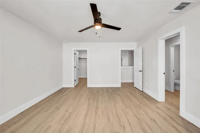 wooden floor in an empty room and a window