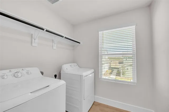 a bathroom with a granite countertop sink toilet mirror and bathtub