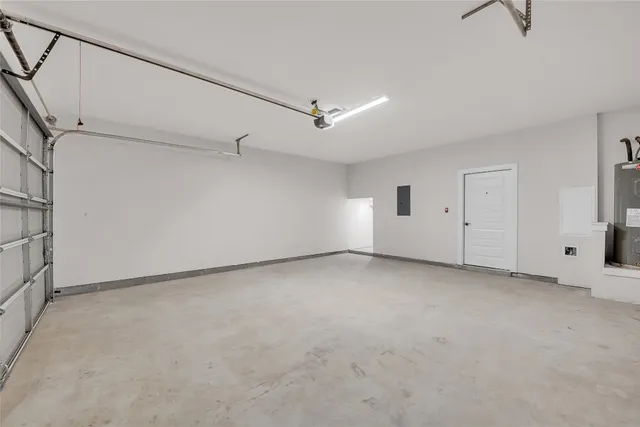 a view of entrance gate with wooden fence