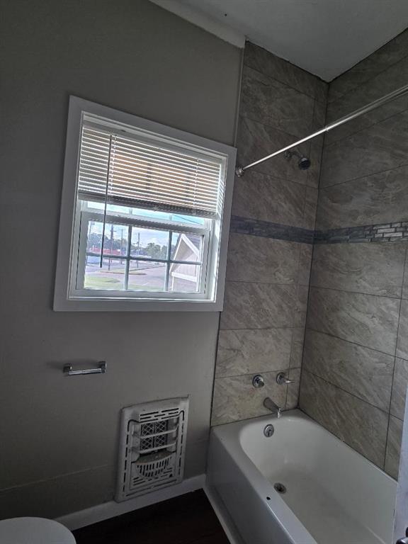 114 South 20th Street Corsicana, TX 75110 - Photo 12 of 15 a bathroom with a bathtub and a shower