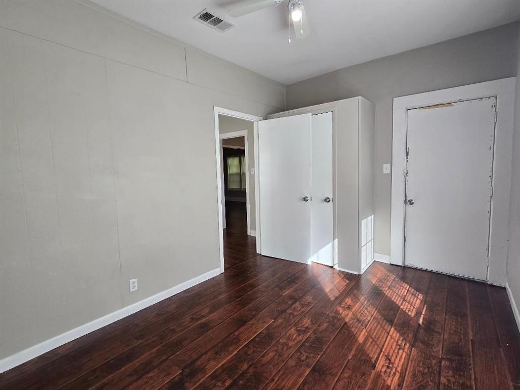 114 South 20th Street Corsicana, TX 75110 - Photo 15 of 15 a view of an empty room with wooden floor