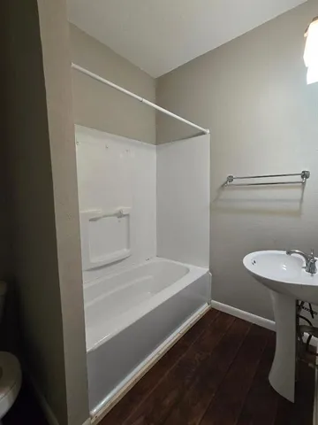 a bathroom with a sink a toilet and vanity