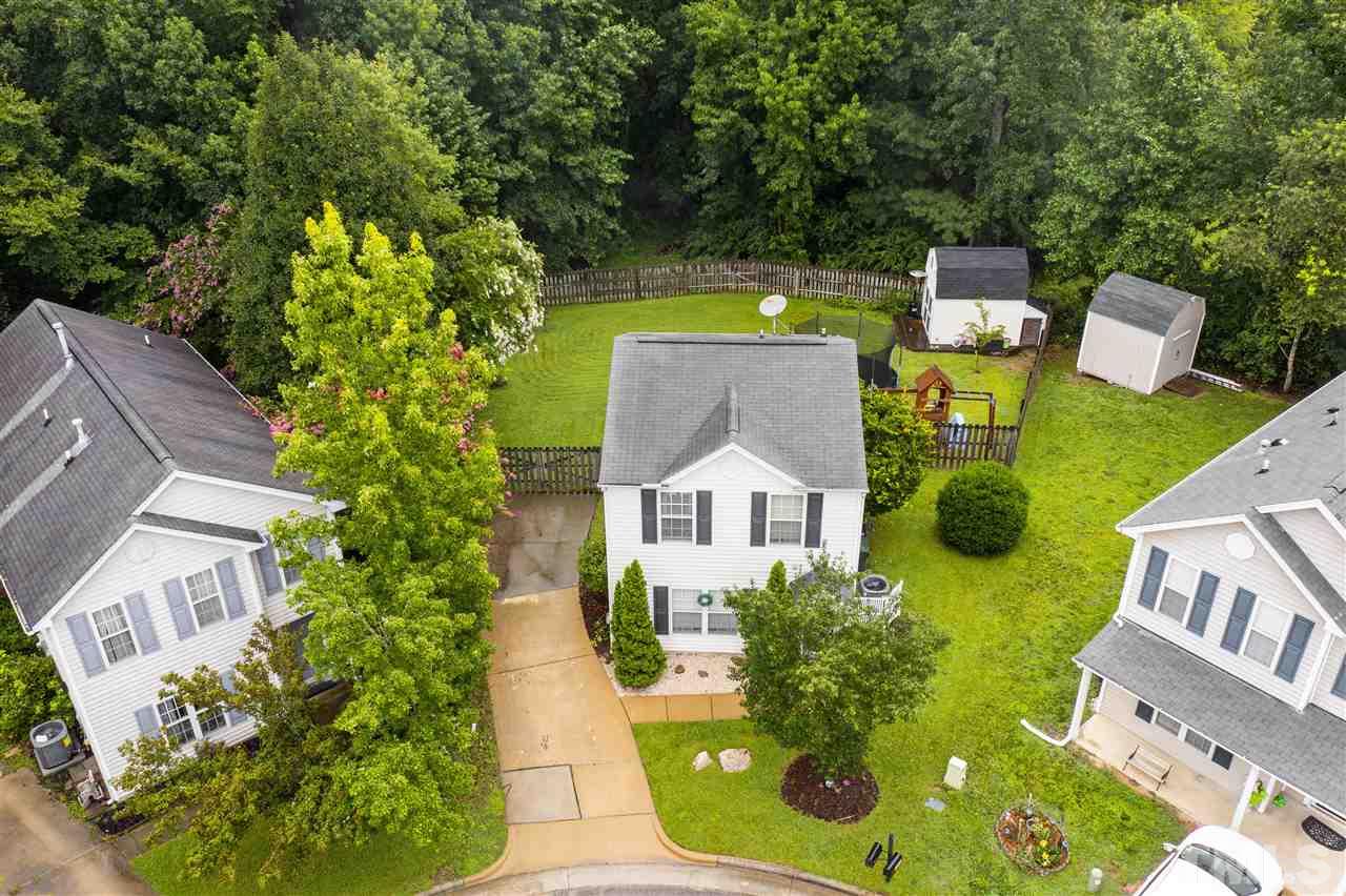 7050 Jeffreys Creek Lane Raleigh, NC 27616 - Photo 2 of 23 an aerial view of a house with swimming pool garden and patio