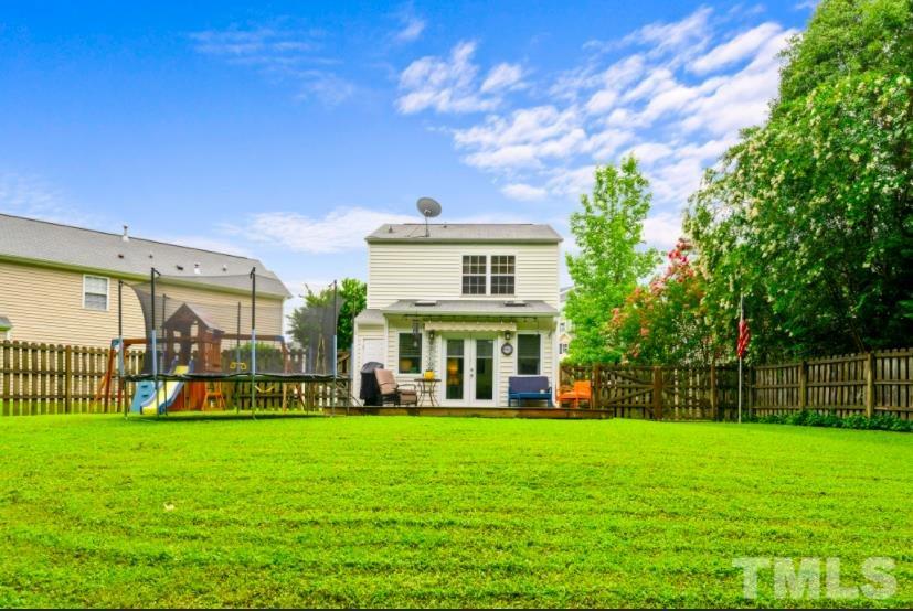 7050 Jeffreys Creek Lane Raleigh, NC 27616 - Photo 19 of 23 a view of a house with a big yard